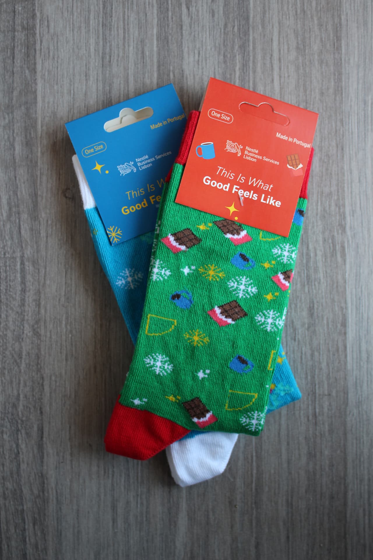 Nestlé Business Services Lisbon branded Christmas socks with printed hang tags